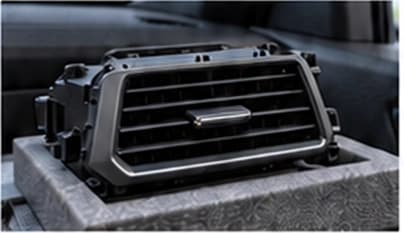 Automotive air vent and interior components